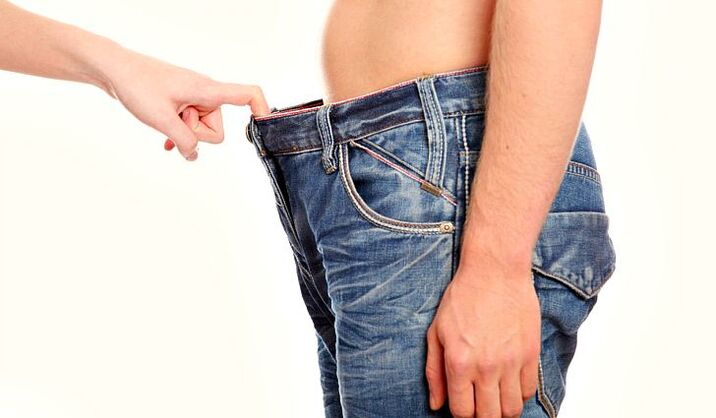 a woman looks at a man's pants with an enlarged penis soda